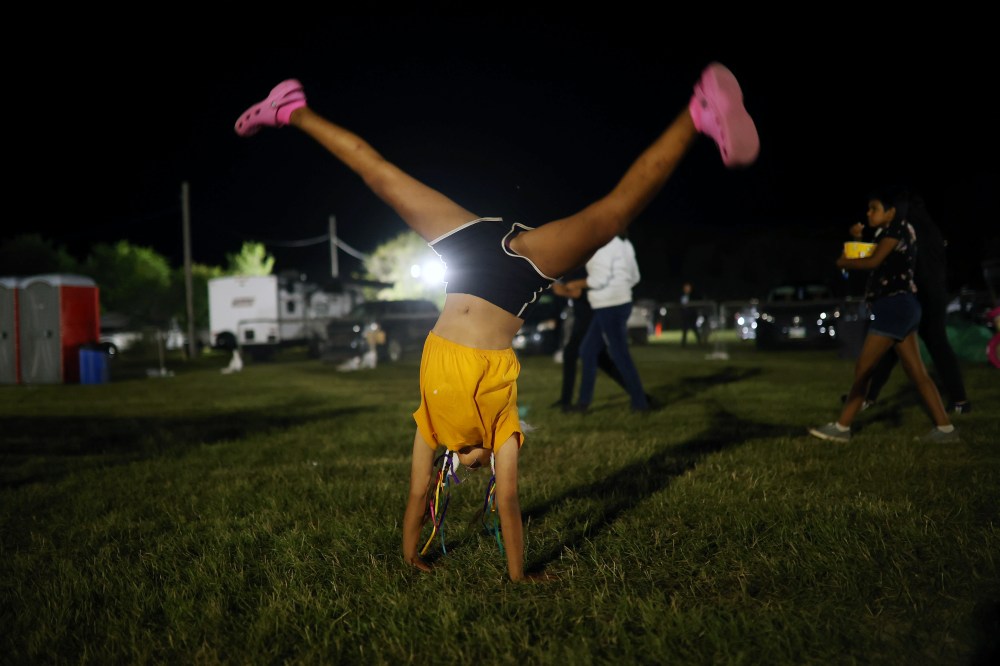 Aislinn Rosmus Kaszas does a cartwheel at the Sioux Valley Dakota Nation Pow Wow on Friday night. (Tim Smith/The Brandon Sun)