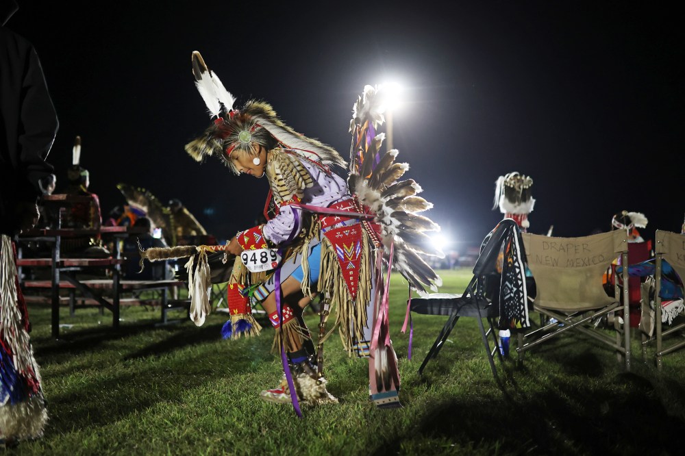 A young boy practices while waiting to dance at the Sioux Valley Dakota Nation Pow Wow on Friday night. (Tim Smith/The Brandon Sun)
