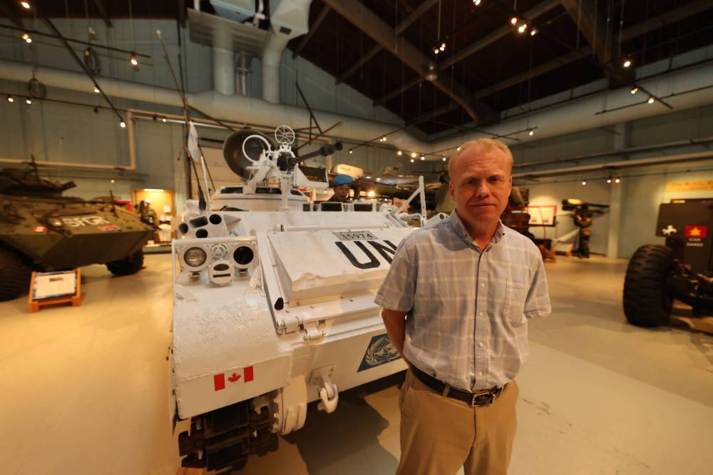 Royal Canadian Artillery Museum director Andrew Oakden stands beside a Track Lynx armoured vehicle that’s part of a new exhibit on Canada’s peacekeeping efforts from the 1950s to the present day. It has been made up to look like the Lynxes that were used in UN peacekeeping missions and is outfitted with a real machine gun on top. (Colin Slark/The Brandon Sun)