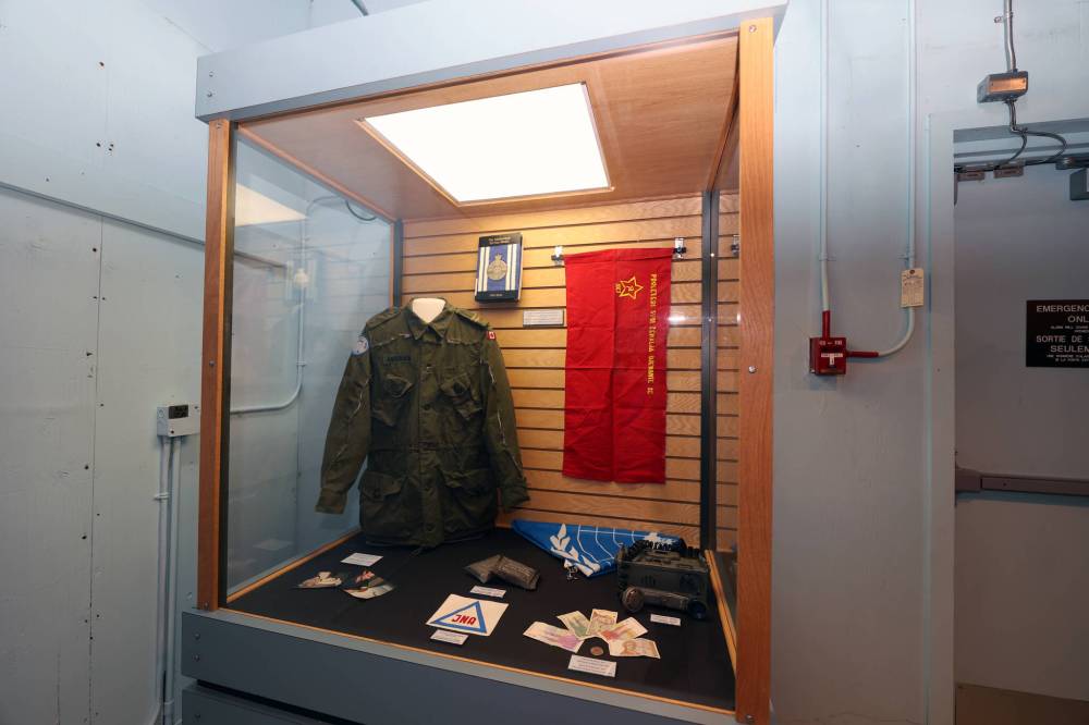 The combat shirt on the left had to be cut off Capt. Ian Anderson when he was wounded in action while serving as a peacekeeper in Bosnia in 1994. (Colin Slark/The Brandon Sun)