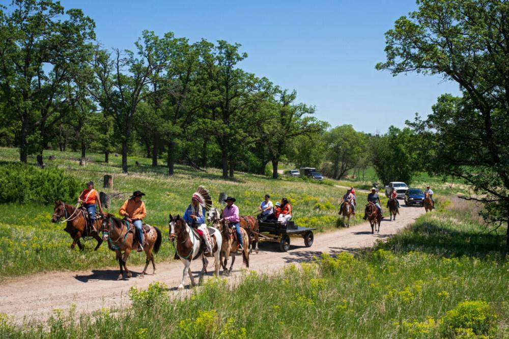 The Dakota Nation Unity Riders from Sioux Valley Dakota Nation and support riders arrive at the site of the former Brandon Indian Residential School at the end of their ride from the Grand Valley Campground in honour of residential school victims and survivors last year. Another ride is scheduled for next week. (File)