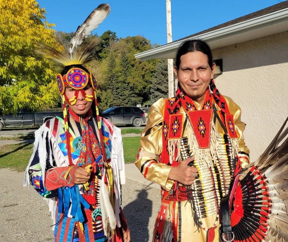 Powwow dancers Sam Jackson, from Sioux Valley Dakota Nation, and Jay Mikey Mantuck, from Waywayseecappo First Nation, donned their traditional regalia and performed for students from Neepawa for the town's Indigenous Culture Day. (Miranda Leybourne/The Brandon Sun)