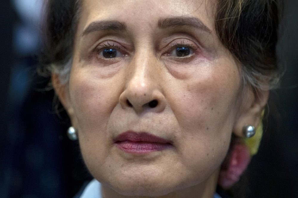 FILE - Myanmar's lthen eader Aung San Suu Kyi waits to address judges of the International Court of Justice on the second day of three days of hearings in The Hague, Netherlands, Dec. 11, 2019. Myanmar convicted ousted leader Aung San Suu Kyi on two more corruption counts on Wednesday, Oct. 12, 2022, extending her total prison term to 26 years. (AP Photo/Peter Dejong, File)
