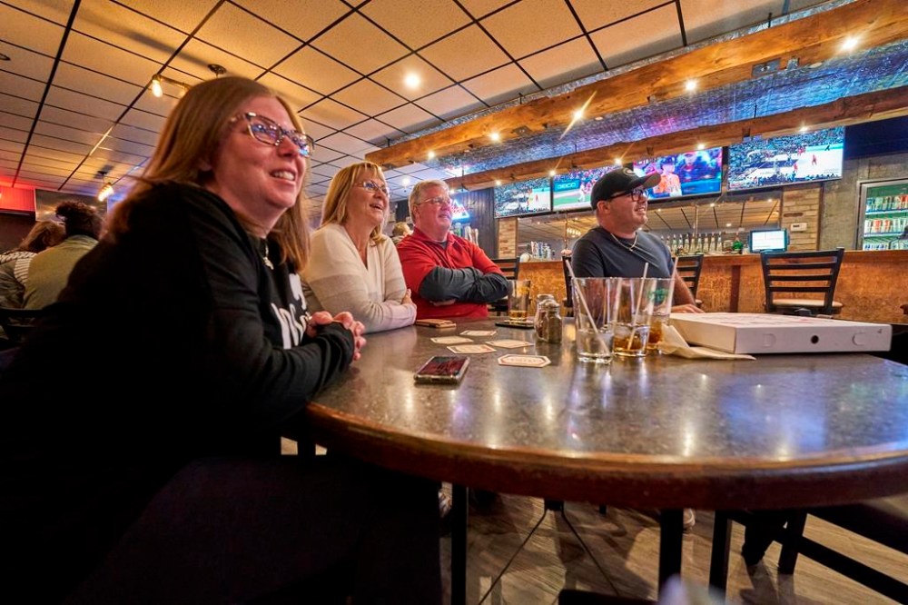 Tanya, left to right, Sharron, Rick and Kevin Schroeter watch game four of the World Series at Antonio’s Pizza in Corunna, Ont., Wednesday, Nov. 2, 2022. There's a new rooting interest in the border town of Corunna, Ont., and surrounding area. The Phillies are getting the love now that local skipper Rob Thomson has guided Philadelphia to the World Series. THE CANADIAN PRESS/Geoff Robins