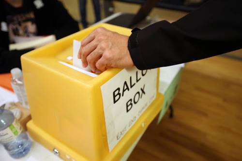 A voter places their ballot in the ballot box at the polling station in the East End Community Centre in Brandon during the 2022 municipal election. (Tim Smith/The Brandon Sun files)