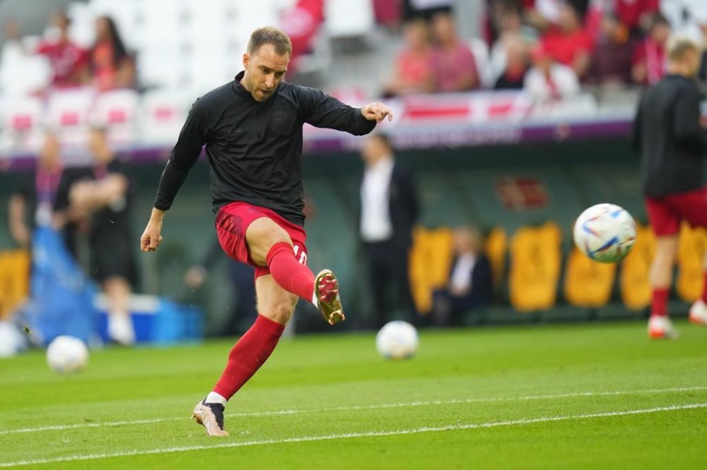 Denmark's Christian Eriksen warms up before the World Cup group D soccer match between Denmark and Tunisia, at the Education City Stadium in Al Rayyan , Qatar, Tuesday, Nov. 22, 2022. (AP Photo/Petr David Josek)