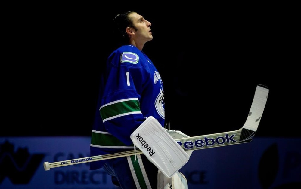 Vancouver Canucks goalie Roberto Luongo looks on during the singing of