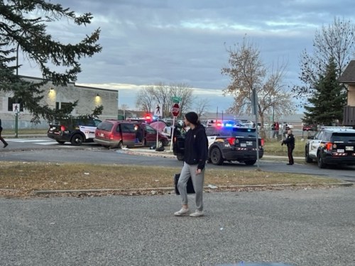 Members of the Brandon Police Service surround Crocus Plains Regional Secondary School Tuesday morning following a call about individuals with guns being in the area. (Submitted)