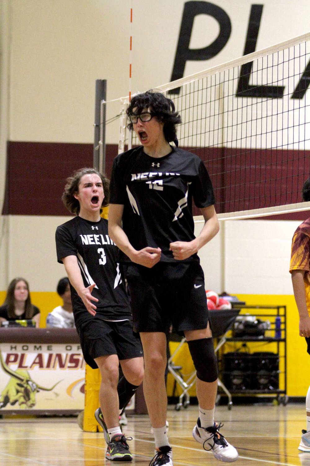 Josh Gamache, left, and Max Winters celebrate a point during the Neelin Spartans’ 3-0 sweep of the Crocus Plainsmen in the Brandon High School Volleybal League varsity boys semifinals on Tuesday. (Thomas Friesen/The Brandon Sun)