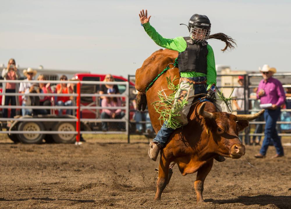 Jett Lockie rides Red River in the steer riding competition at the at the Waywayseecappo First Nation Highway 10 Rodeo last year. Lockie is heading to Las Vegas next week to compete in the Junior World Finals. (File)