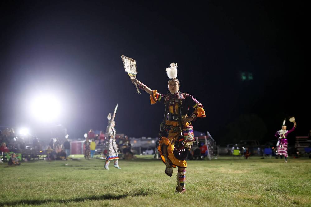 Dancers compete under lights at the Sioux Valley Dakota Nation Powwow in August.