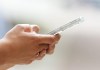 A person uses a cell phone in Ottawa on Monday, July 18, 2022. An Alberta health-care worker has been sentenced for taking photos of long-term care residents and posting them on social media, including a distorted image of a resident using with a bug-eye filter. THE CANADIAN PRESS/Sean Kilpatrick