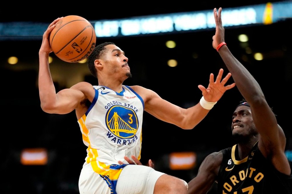 Toronto Raptors forward Pascal Siakam (43) tries to stop Golden State Warriors guard Jordan Poole (3) from going to the net during second half NBA basketball action in Toronto, Sunday, Dec. 18, 2022. Poole poured in a career-high 43 points as the Golden State Warriors earned a 126-110 win and handed the Toronto Raptors a fifth consecutive loss on Sunday. THE CANADIAN PRESS/Frank Gunn