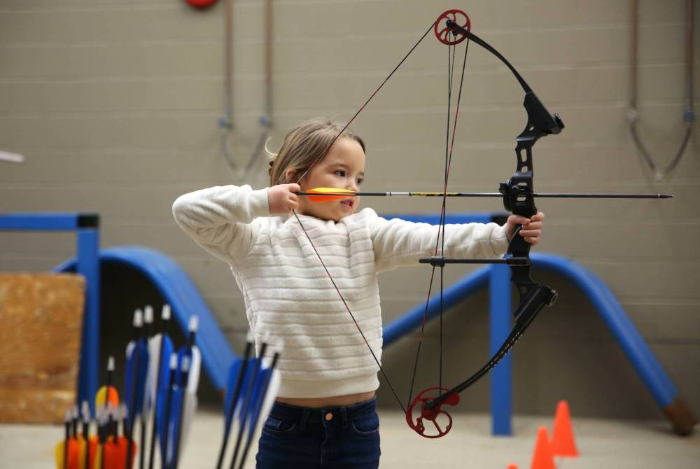Iris Wilson, 5, from St. Anne, Man., takes aim during the Manitoba 3D Archery Challenge at the Keystone Centre on Sunday. (Michele McDougall/The Brandon Sun)