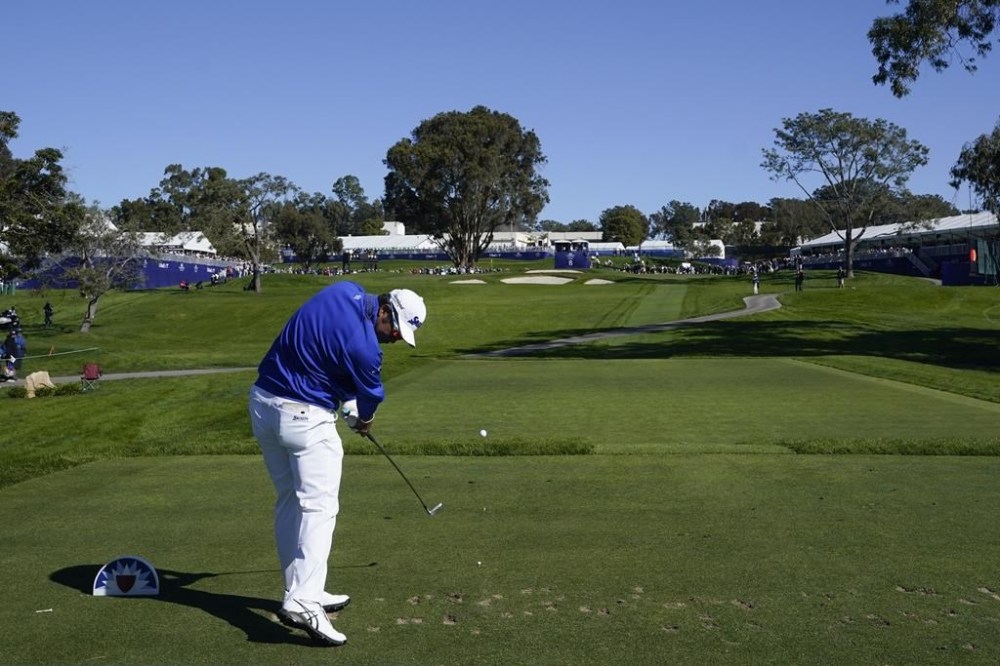 Hideki Matsuyama, of Japan, hits his tee shot on the eighth hole of the South Course at Torrey Pines during the second round of the Farmers Insurance Open golf tournament Thursday, Jan. 26, 2023, in San Diego. (AP Photo/Gregory Bull)