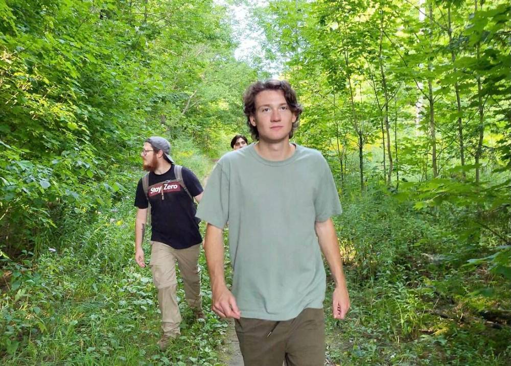 Ryan Willis, host of a new television show coming to the Wild TV Network this fall called “Sasquatch University” and president of the Trent University Sasquatch Society in Peterborough, Ont., leads Cody Misner and Joel Porter into the woods to search for Bigfoot. (Submitted)