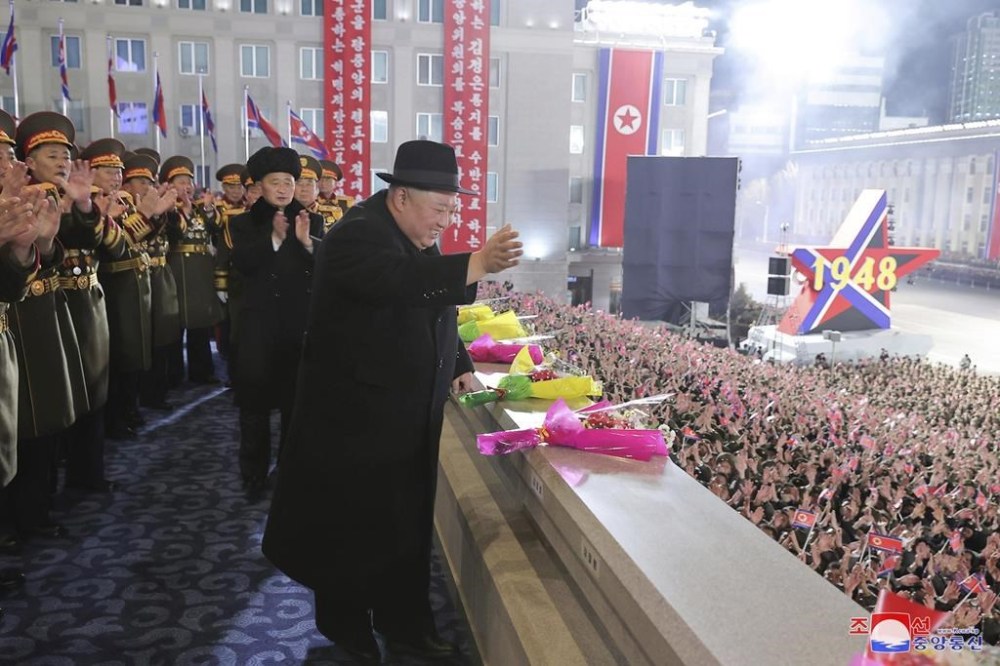 In this photo provided by the North Korean government, North Korean leader Kim Jong Un waves his hand towards people during a military parade at Kim Il Sung Square in Pyongyang, North Korea, Wednesday, Feb. 8, 2023. Independent journalists were not given access to cover the event depicted in this image distributed by the North Korean government. The content of this image is as provided and cannot be independently verified. Korean language watermark on image as provided by source reads:
