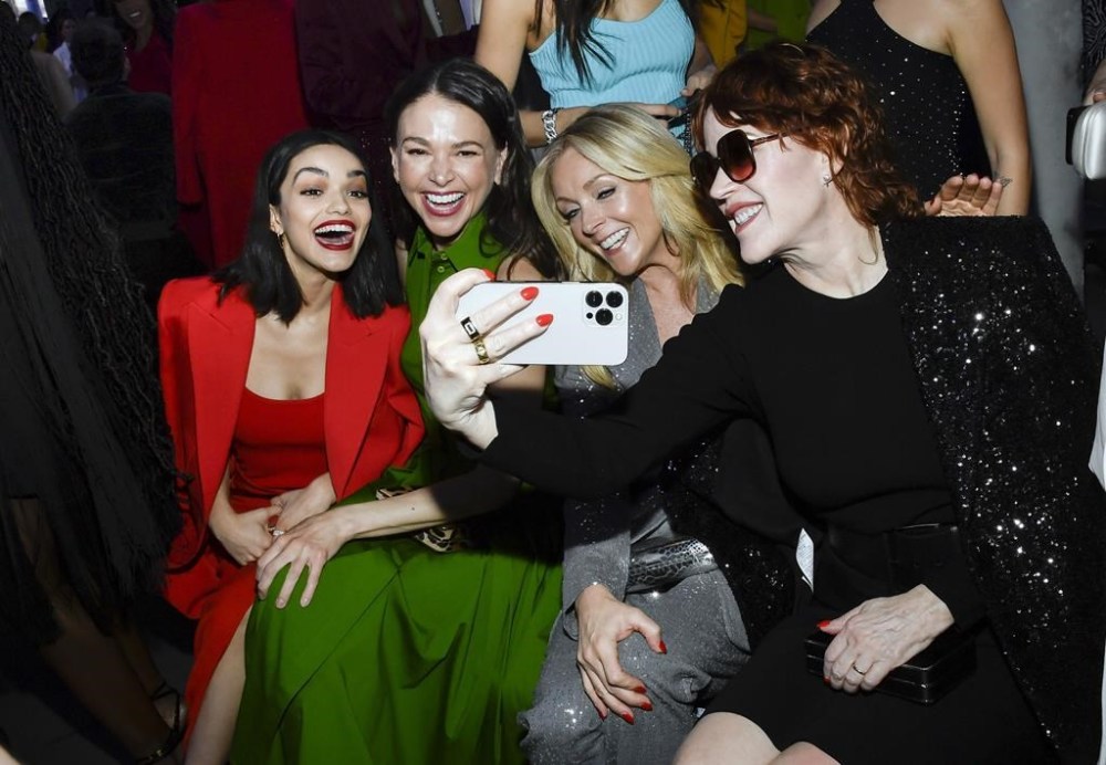 Rachel Zegler, from left, Sutton Foster, Jane Krakowski and Molly Ringwald pose for a selfie at the Michael Kors Fall/Winter 2023 fashion show on Wednesday, Feb. 15, 2023, in New York. (Photo by Evan Agostini/Invision/AP)
