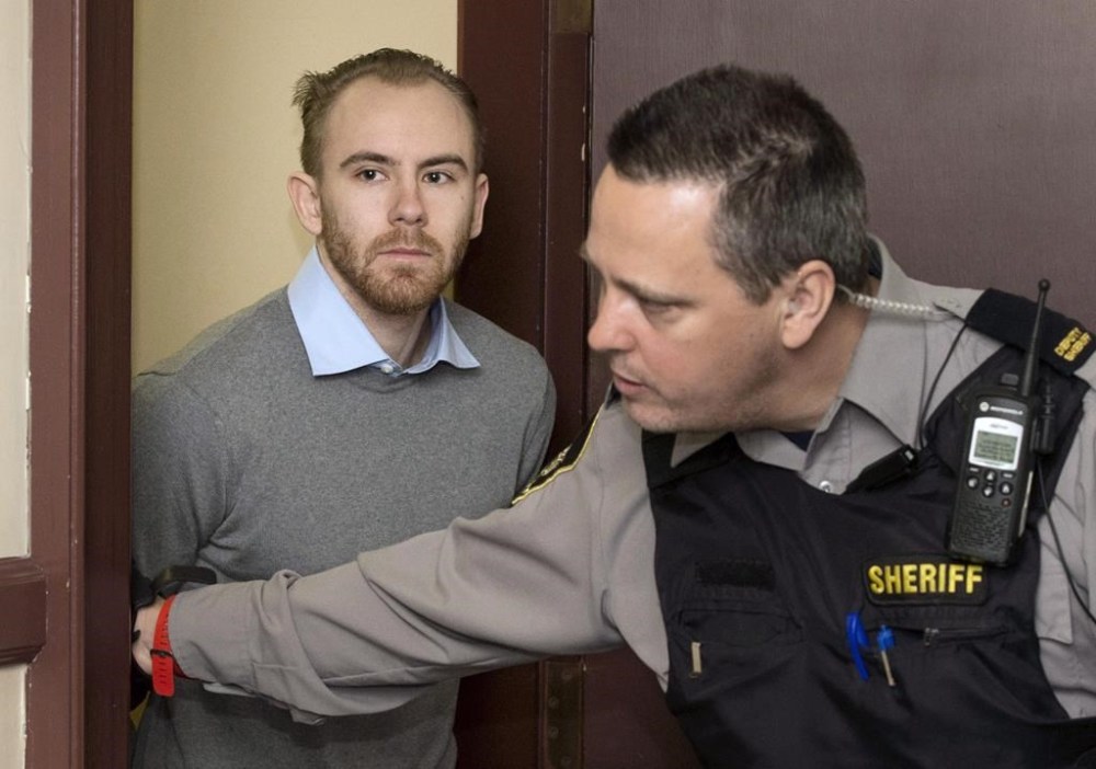 William Sandeson, left, arrives for his preliminary hearing at provincial court in Halifax on Thursday, February 11, 2016.A jury started its third day of deliberations today in the trial of a former Halifax medical student charged with first-degree murder in the 2015 shooting death of a fellow student. THE CANADIAN PRESS/Darren Calabrese