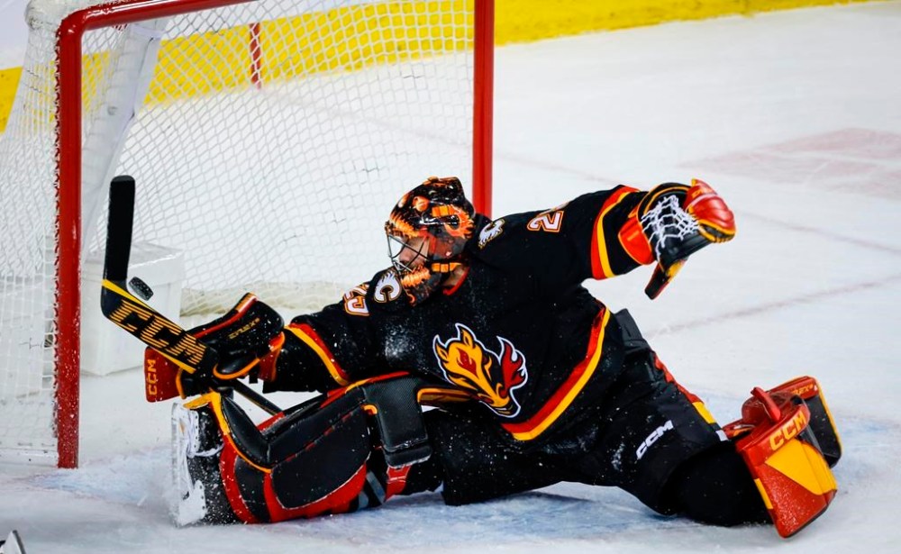 Calgary Flames goalie Jacob Markstrom lets in the game-winning goal during overtime NHL hockey action against the Boston Bruins in Calgary, Tuesday, Feb. 28, 2023. The Flames have work to do to get back into playoff position in the NHL. The Flames are five points out of Western Conference wild-card spot with a quarter of their regular season remaining.THE CANADIAN PRESS/Jeff McIntosh