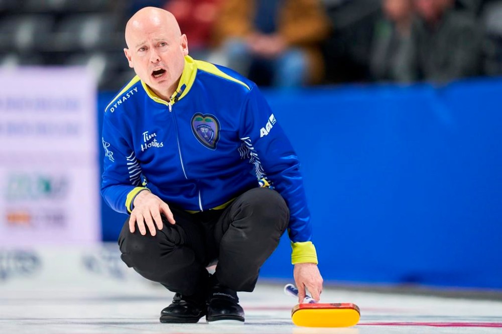 Alberta skip Kevin Koe watches his shot during his match against Reid Carruthers' Wild Card team from the Morris Curling Club in Manitoba at the 2023 Tim Hortons Brier at Budweiser Gardens in London, Ont. on Monday, March 6, 2023. THE CANADIAN PRESS/ Geoff Robins