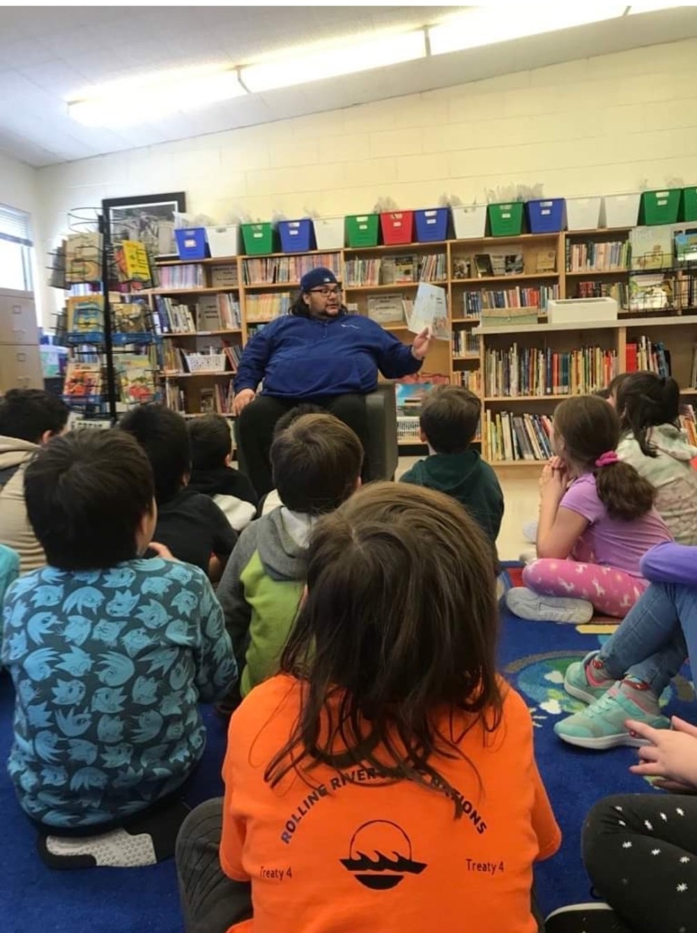 Dale Turcotte, member of Rolling River First Nation, reads to second grade students at Erickson Elementary School on Tuesday, during I Love to Read Month. (Submitted)