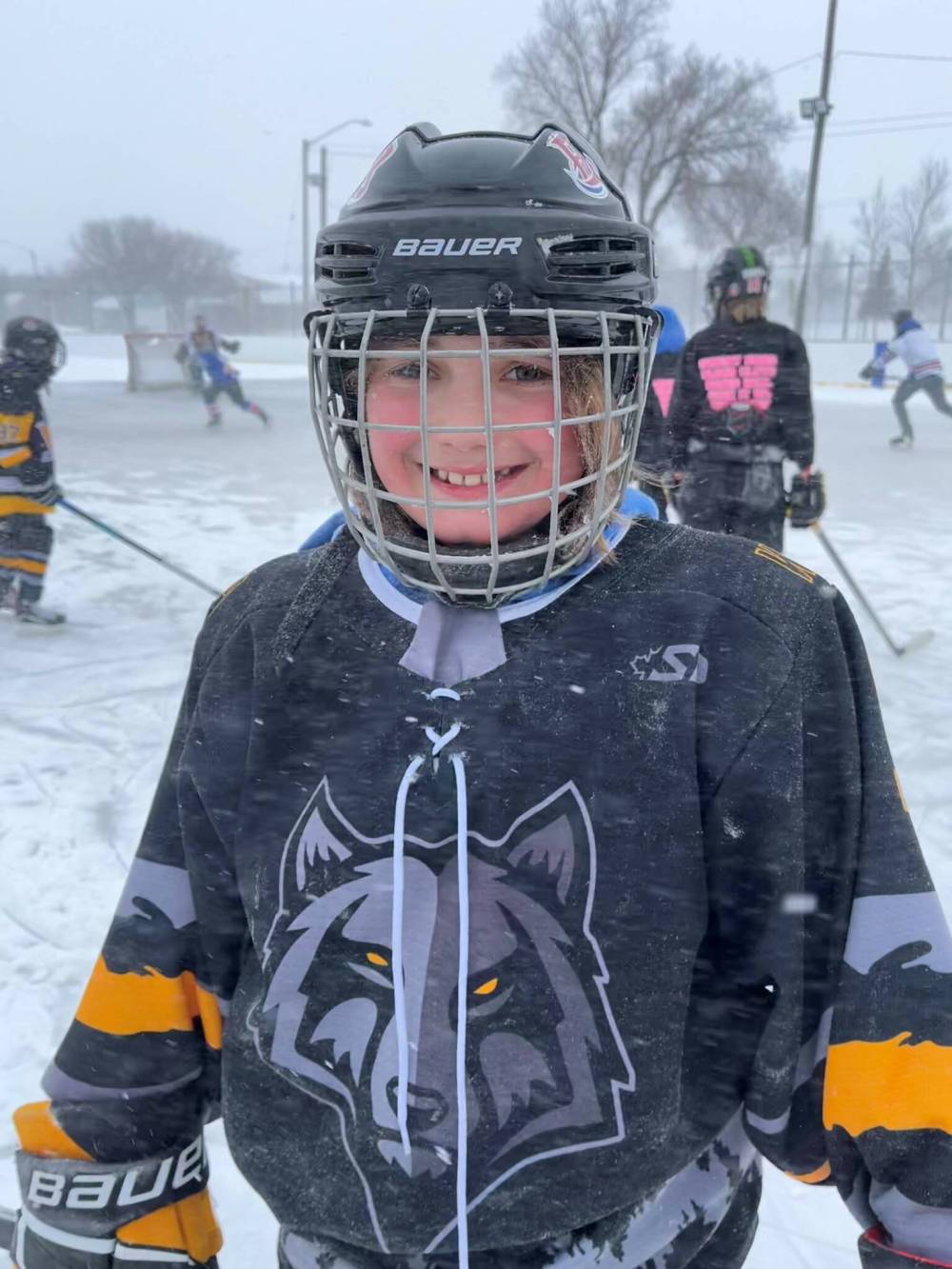 Jordan Lang is all smiles during the U13 Reach Eaves Cleaning Hurricanes’ parent versus player hockey game that took place at the East End Community Centre during Saturday’s blizzard. (Submitted)