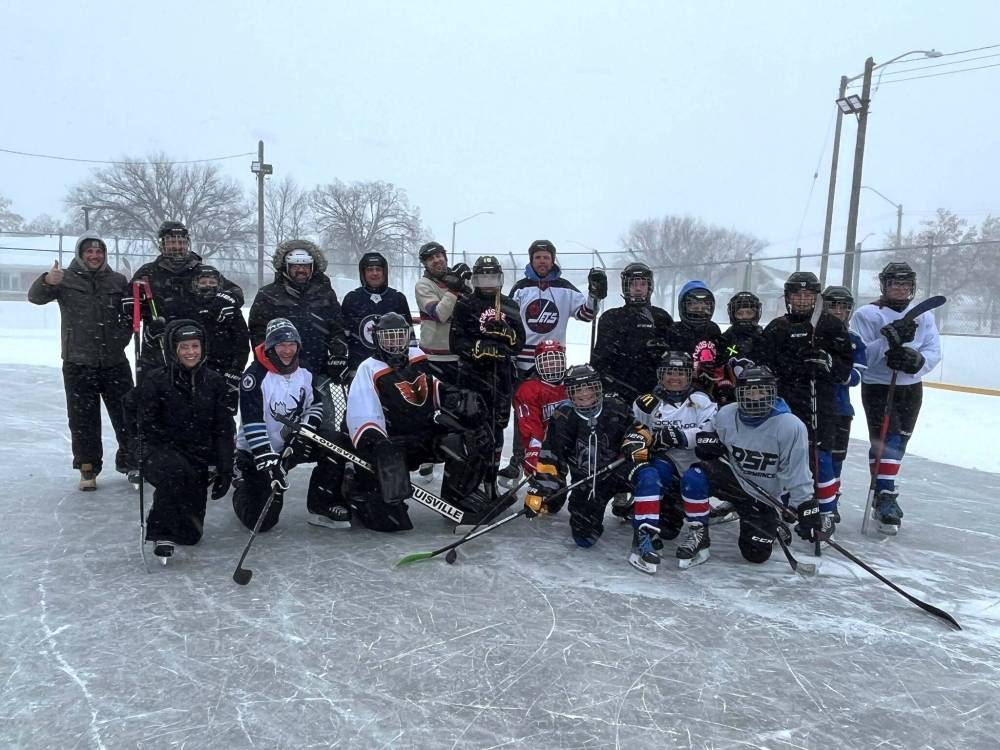 Members of the U13 Reach Eaves Cleaning Hurricanes hockey team pose for a group photo during a parent versus player game that took place at the East End Community Centre Saturday afternoon. The group managed to have a good time despite Saturday’s blizzard, which dumped around seven centimetres of snow on Brandon and the surrounding area. (Submitted)