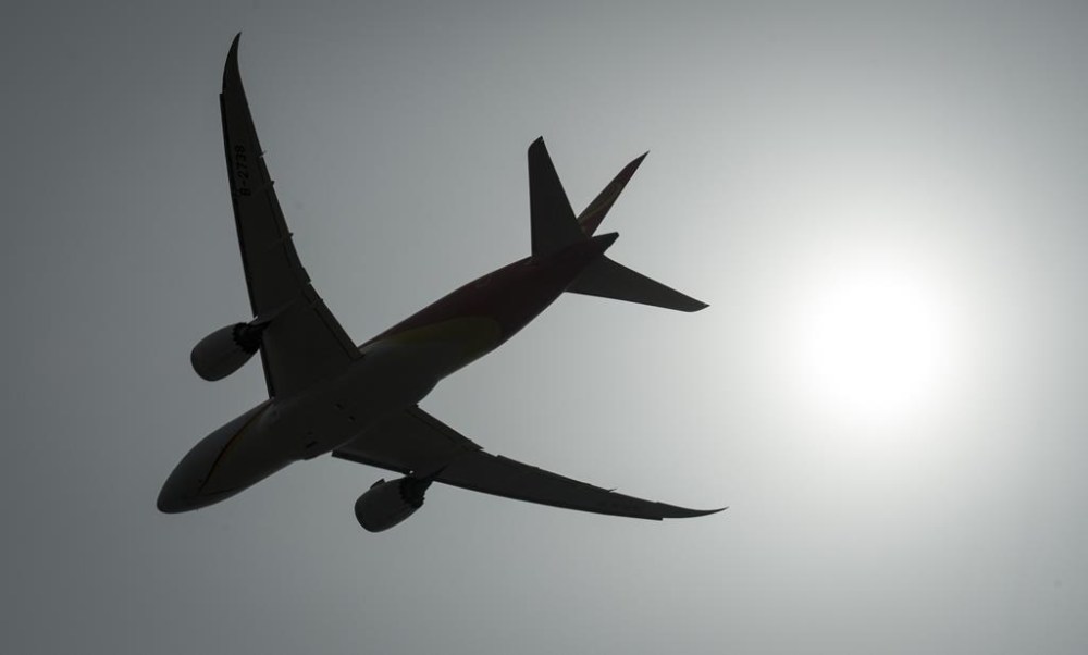The Transportation Safety Board says pilots in Canada need better guidelines for screening heart-related conditions. A plane is silhouetted as it takes off from Vancouver International Airport in Richmond, B.C., Monday, May 13, 2019. THE CANADIAN PRESS/Jonathan Hayward