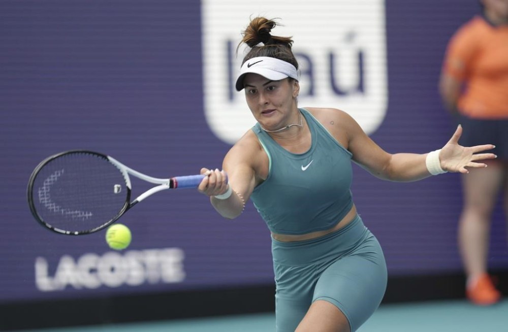 Bianca Andreescu, of Canada, returns a volley from Emma Raducanu, of Great Britain, in the first set of a match at the Miami Open tennis tournament, Wednesday, March 22, 2023, in Miami Gardens, Fla. THE CANADIAN PRESS/AP-Jim Rassol