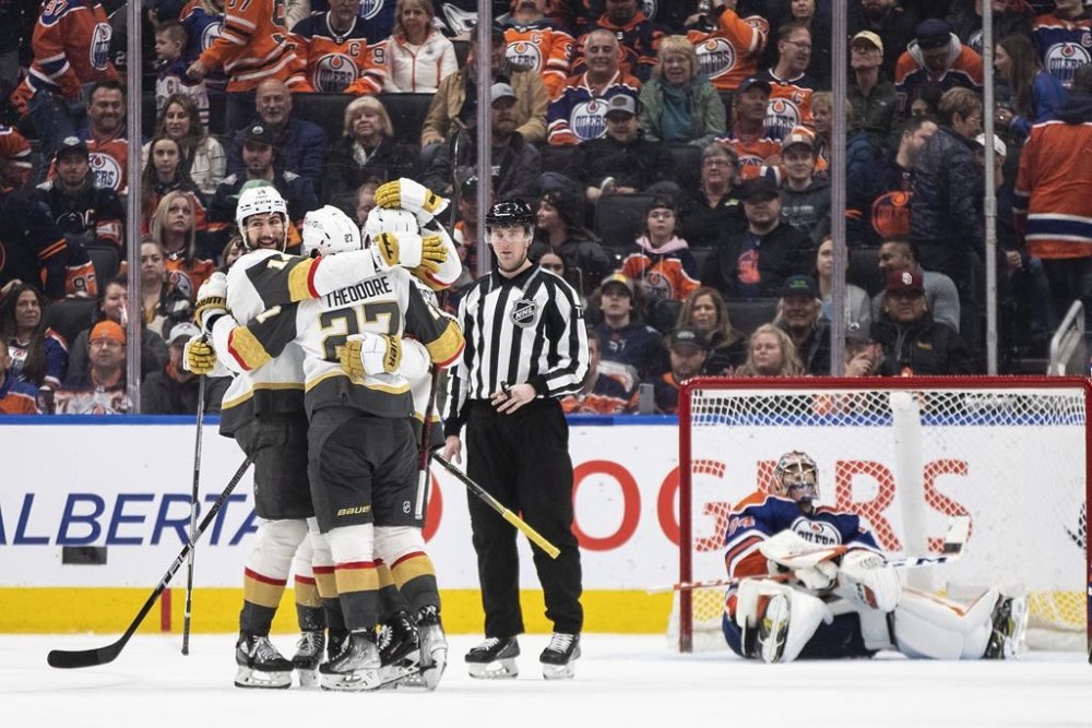 Vegas Golden Knights celebrate the winning goal on Edmonton Oilers goalie Stuart Skinner (74) during overtime NHL action in Edmonton on Saturday March 25, 2023.THE CANADIAN PRESS/Jason Franson