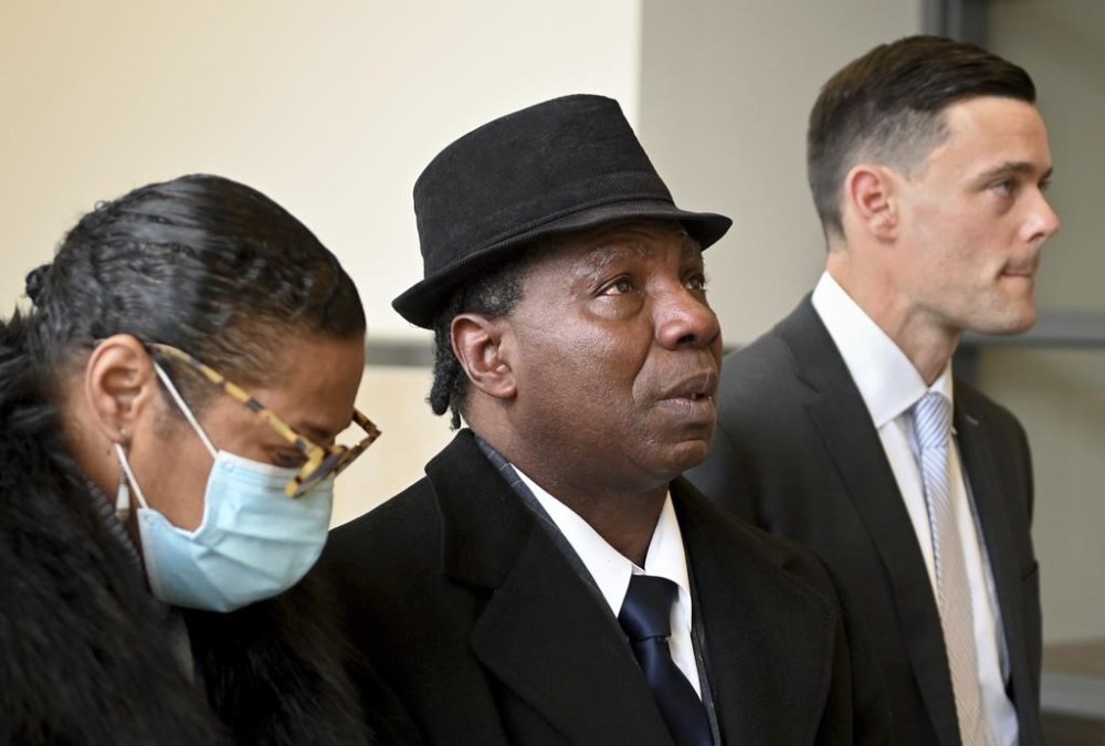 FILE - Anthony Broadwater, center, gazes upward, Nov. 22, 2021, in Syracuse, N.Y., after Judge Gordon Cuffy overturned the 40-year-old rape conviction that wrongfully put him in state prison for Alice Sebold's rape. Broadwater, who spent 16 years in prison, has settled a lawsuit against New York state for $5.5 million, his lawyers said Monday, March 27, 2023. (Katrina Tulloch/The Post-Standard via AP, File)