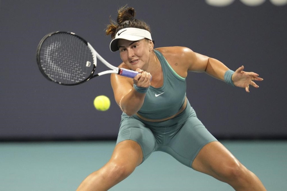 Bianca Andreescu, of Canada, returns a volley against Ekaterina Alexandrova, of Russia, in the first set of a match at the Miami Open tennis tournament, Monday, March 27, 2023, in Miami Gardens, Fla. Andreescu provided an injury update of sorts on Tuesday, saying she's still waiting on official test results after injuring her lower left leg at the Miami Open.THE CANADIAN PRESS/APJim Rassol