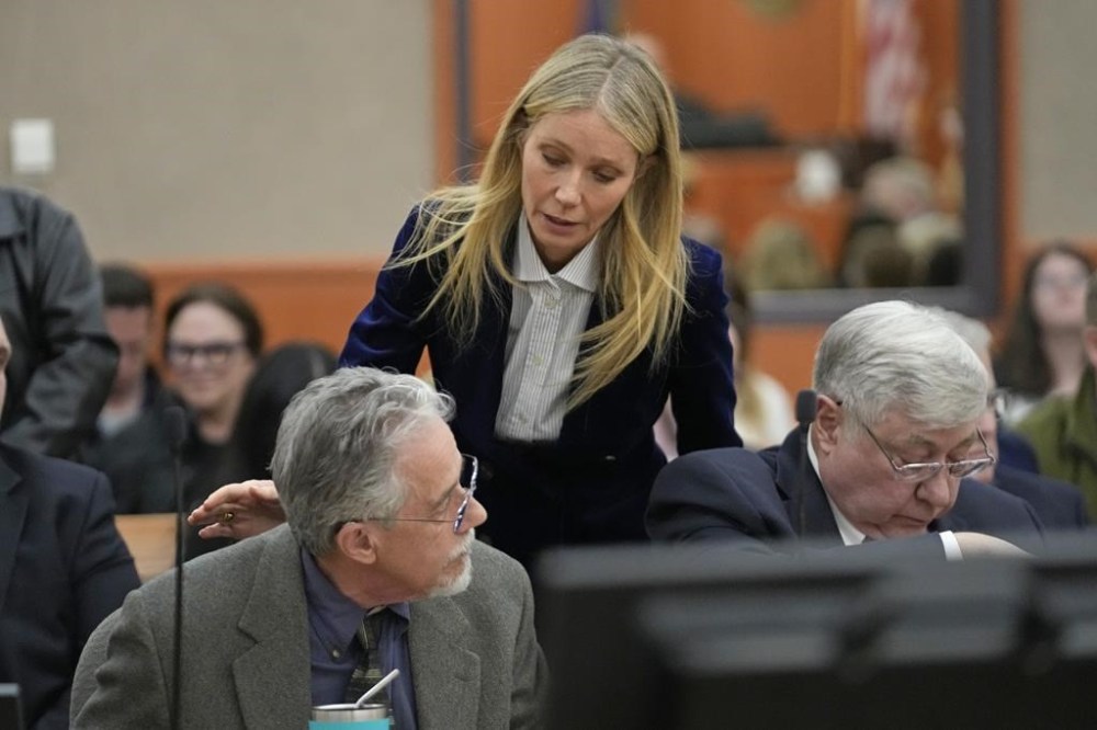 Gwyneth Paltrow speaks with retired optometrist Terry Sanderson,left, as she walks out of the courtroom following the reading of the verdict in their lawsuit trial, Thursday, March 30, 2023, in Park City, Utah. Paltrow won her court battle over a 2016 ski collision at a posh Utah ski resort after a jury decided Thursday that the movie star wasn’t at fault for the crash. (AP Photo/Rick Bowmer, Pool)