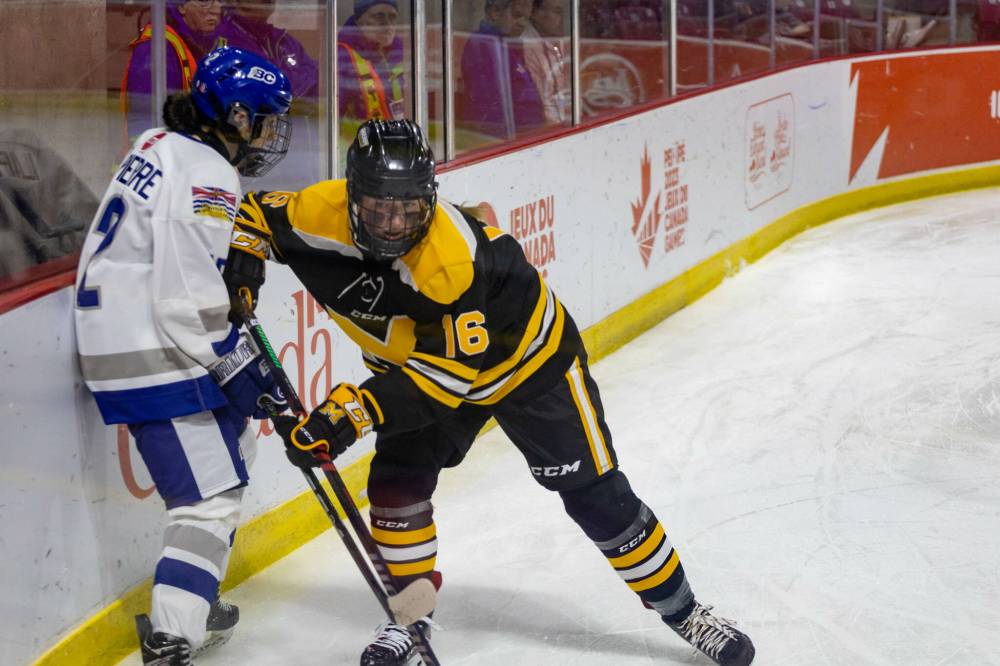 Brandon's Callie Rice gives a shove to Danica Maynard during Manitoba's matchup with British Columbia at the 2023 Canada Winter Games. (Photo Courtesy Karrie Costain/Canada Winter Games)