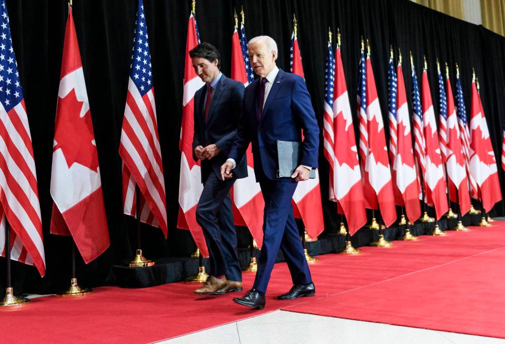 U.S. President Joe Biden and Prime Minister Justin Trudeau depart after a joint news conference in Ottawa on March 24. (The Canadian Press)