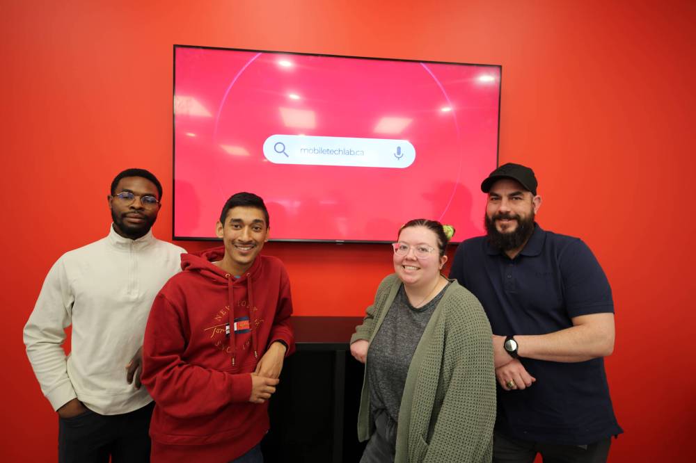 (From left) Mobile Tech Labs co-founders Daniel Okagbare and Kyle Jagassar, technician Kelly Paddock and operations manager Gilles Laurin. (Colin Slark/The Brandon Sun)