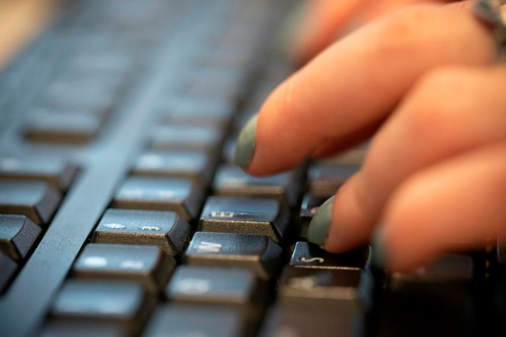 Women use generative artificial intelligence less than men do, but Louise Champoux-Paillé and Anne-Marie Croteau write that they need to be trained in the technology to compete in the workplace and to play a role in making it fair. (File)