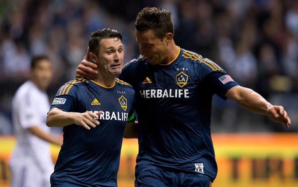 Los Angeles Galaxy's Robbie Keane, left, of Ireland, and Rob Friend celebrate Keane's goal against the Vancouver Whitecaps during second half MLS soccer action in Vancouver, B.C., on Saturday April 19, 2014. Friend is now in charge of the expansion Vancouver FC in the Canadian Premier League. THE CANADIAN PRESS/Darryl Dyck