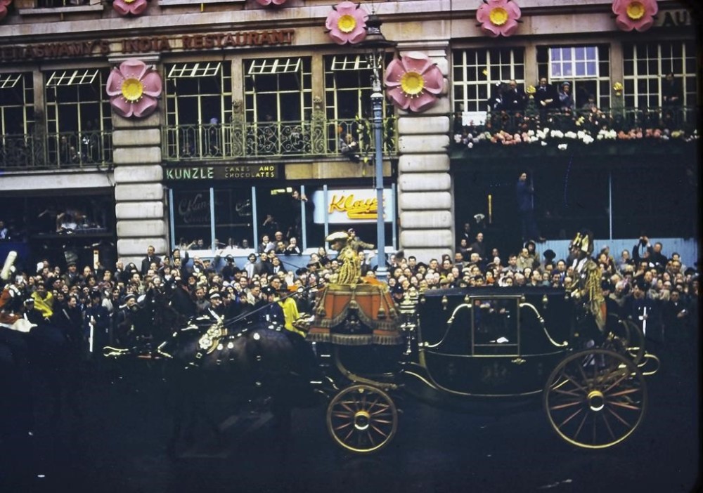 In this photo provided by Max Hancock, The Queen Mother and Princess Margaret’s carriage passes crowds of people during Queen Elizabeth II’s coronation parade in London, June 2, 1953. Hancock, a 19-year-old from Sparks, Georgia, was a U.S. airman stationed at RAF Brize Norton near Oxford at the time of the coronation. As Americans, Hancock and his buddies had no allegiance to the British monarch, but they knew the coronation would be a historic event so they made the 70-mile trip to London by bus and train, then joined the crowds hoping to see the queen pass by. (Max Hancock via AP)