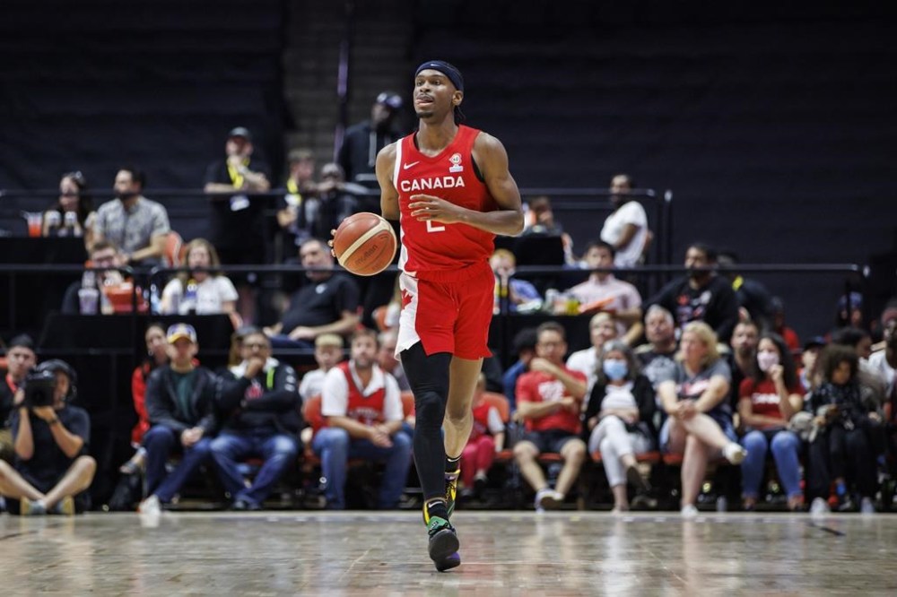 Canada's Shai Gilgeous-Alexander (2) dribbles up the court during second half FIBA international men's World Cup basketball qualifying action against Dominican Republic, in Hamilton, Ont., Friday, July 1, 2022. The Canadian men's basketball team will play France, Latvia and Lebanon in Group H at the 2023 FIBA World Cup this summer. THE CANADIAN PRESS/Cole Burston