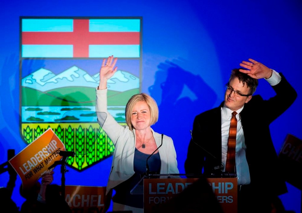 NDP leader Rachel Notley, left, and her husband Lou Arab react on stage after Notley was elected Alberta Premier in Edmonton on Tuesday, May 5, 2015. THE CANADIAN PRESS/Nathan Denette