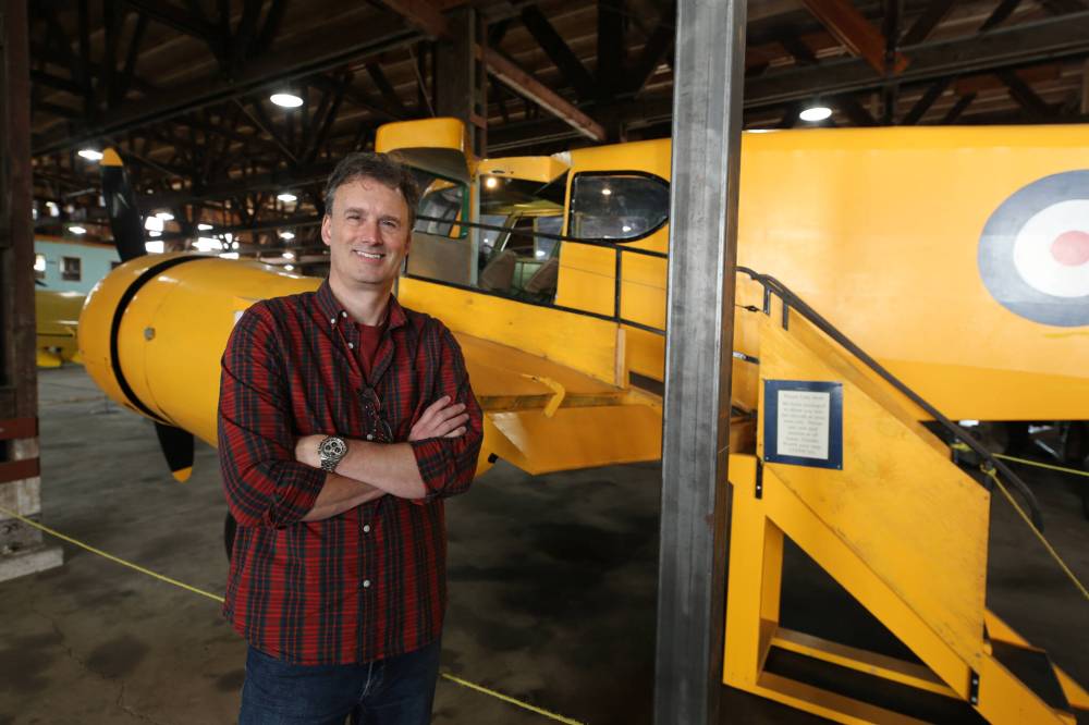 Commonwealth Air Training Plan Museum executive director Stephen Hayter stands beside a metal beam installed as part of emergency structural work done on the museum's Second World War-era hangar. The museum is scheduled to reopen this Sunday after being closed for eight months. (Colin Slark/The Brandon Sun)