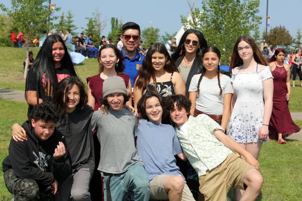 Indigenous students in Grade 8 from Meadows School with principal Dave Lim and counsellor Alicia DeDecker are excited as they wait for the Our Journey, Indigenous Student Graduation Celebration to begin at the Riverbank Discovery Centre in Brandon on Wednesday.