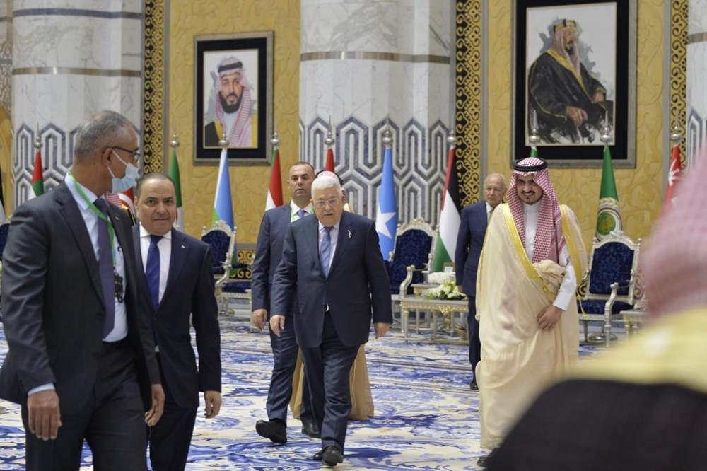 In this photo provided by Saudi Press Agency, SPA, Palestinian President Mahmoud Abbas, is accompanied by Prince Bandar Bin Sultan, the deputy governor of Mecca, upon his arrival at Jeddah airport, Saudi Arabia, Thursday, May 18, 2023, ahead of the Arab summit. (Saudi Press Agency via AP)