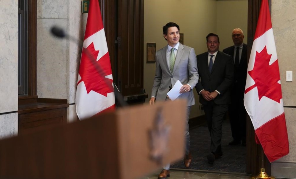 Prime Minister Justin Trudeau, Minister of Public Safety Marco Mendicino (centre) and Minister of Emergency Preparedness Bill Blair arrive to hold a press conference on Parliament Hill in Ottawa on Tuesday, May 23, 2023. The federal government is proclaiming a National Day Against Gun Violence, to be held annually on the first Friday of June. THE CANADIAN PRESS/Sean Kilpatrick