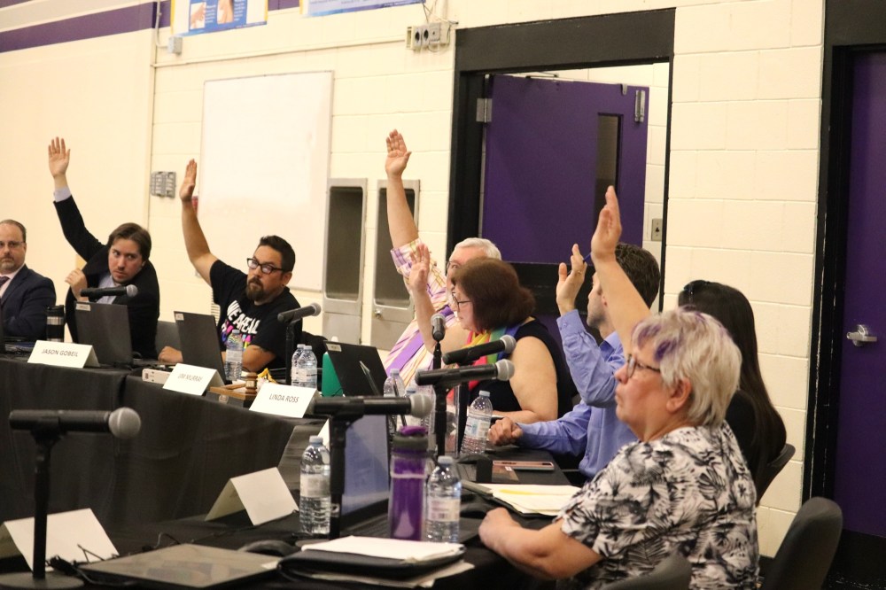 Six Brandon school board trustees — Duncan Ross, Jason Gobeil, Jim Murray, Linda Ross, Blaine Foley and Kim Fallis — vote against the creation of a LGBTQ+ book review committee during Tuesday's board meeting at Vincent Massey High School. The only holdout was Breeanna Sieklicki, while Calistus Ekenna was not in attendance to vote. (Kyle Darbyson/The Brandon Sun)