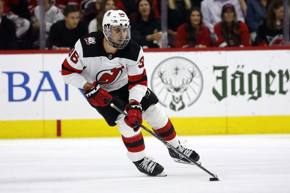 FILE - New Jersey Devils' Timo Meier (96) skates with the puck against the Carolina Hurricanes during the first period of Game 2 of an NHL hockey Stanley Cup second-round playoff series in Raleigh, N.C., May 5, 2023. The Devils announced Wednesday, June 28, that the team has agreed to terms with restricted free agent winger Meier on an eight-year contract worth $70.4 million. (AP Photo/Karl B DeBlaker, File)