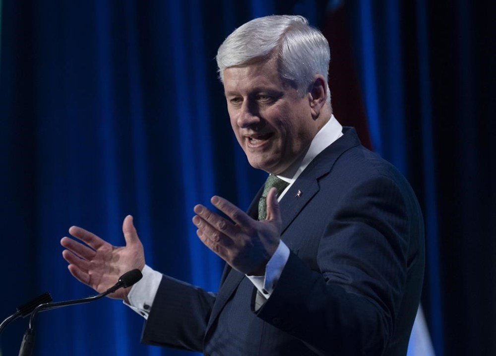 Former Prime Minister Stephen Harper delivers the keynote address at a conference, Wednesday, March 22, 2023 in Ottawa. THE CANADIAN PRESS/Adrian Wyld