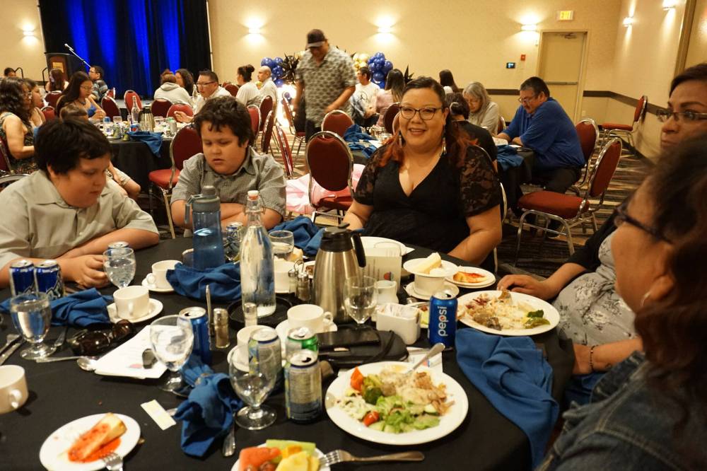 Melanie Cameron (centre) graduated from Yellowquill University College in Winnipeg this year with a rehabilitation assistant diploma. Cameron was celebrated with other graduates from Rolling River First Nation at a luncheon at the Victoria Inn in Brandon on Friday, June 30. (Miranda Leybourne/The Brandon Sun)